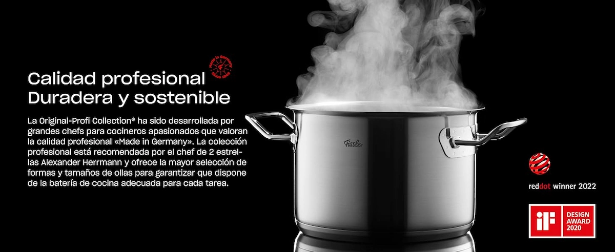 Olla Fissler de acero inoxidable expulsando vapor sobre fondo negro, acompañada de texto promocional sobre su calidad profesional y los sellos de premios Red Dot Winner 2022 e iF Design Award 2020.